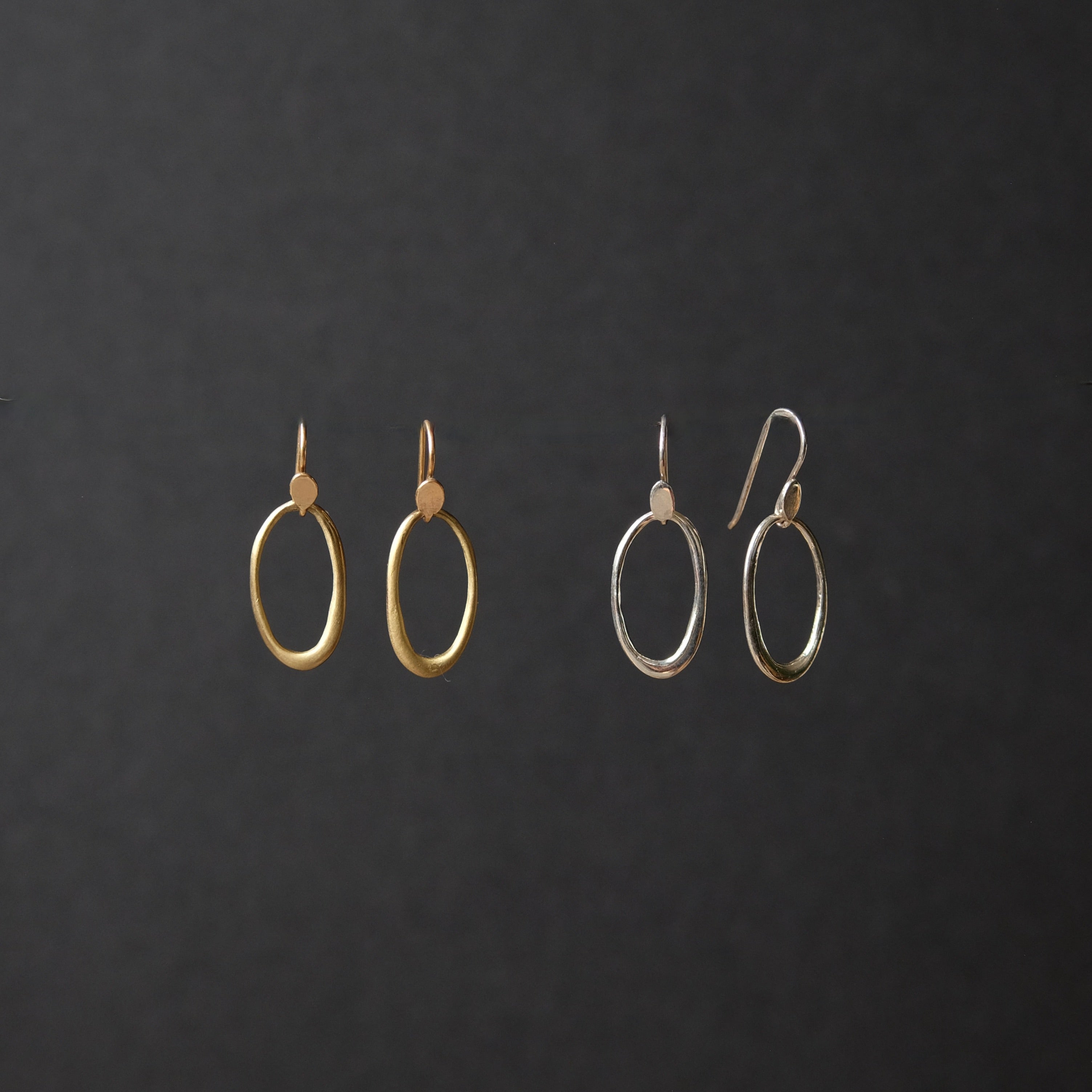 Simple Loop EarringsThese polished simple loop shaped earrings are delicate and light with plenty of movement.  The lightweight modest length, dangling earrings are  the perfect accessory to wear day in and day out. Dimension: 1-1/4" long
