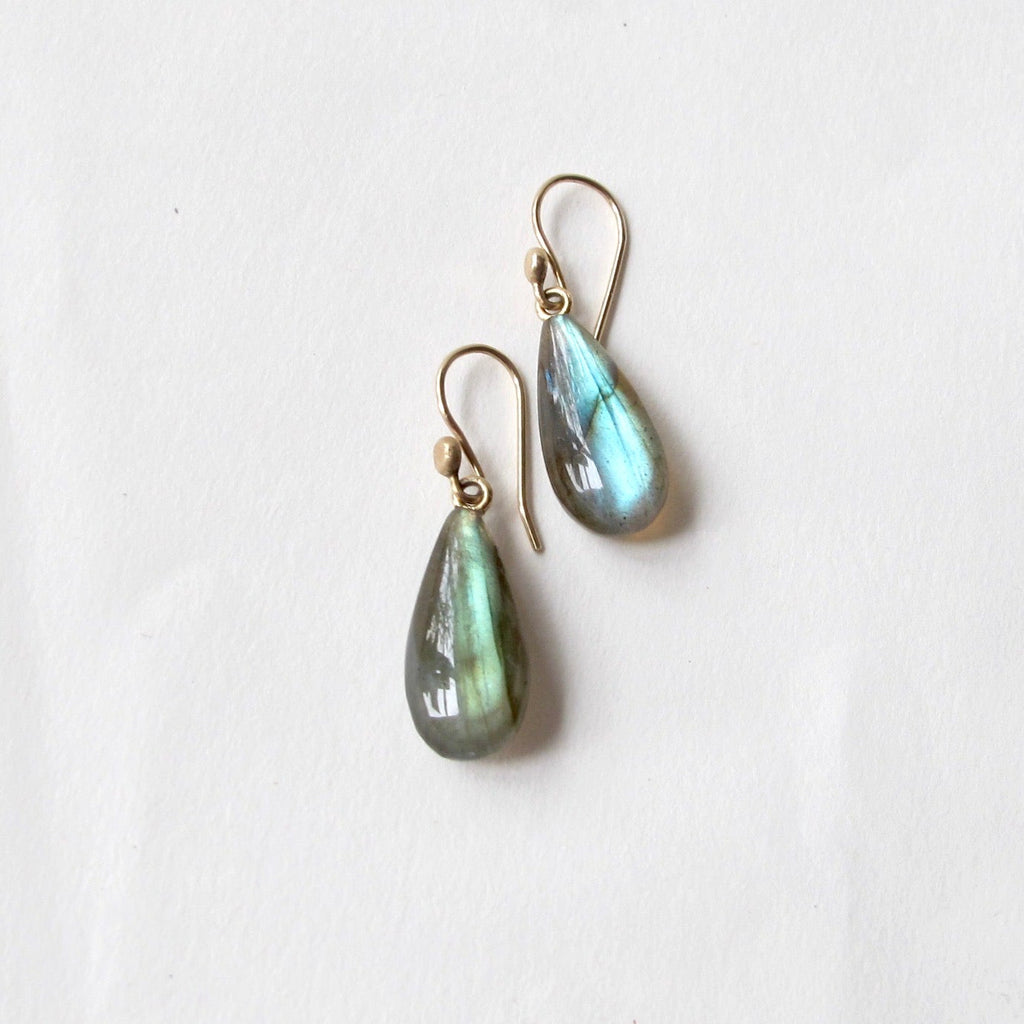 A pair of teardrop-shaped labradorite drop earrings with gold fishhook wires, displayed on a clean white background.