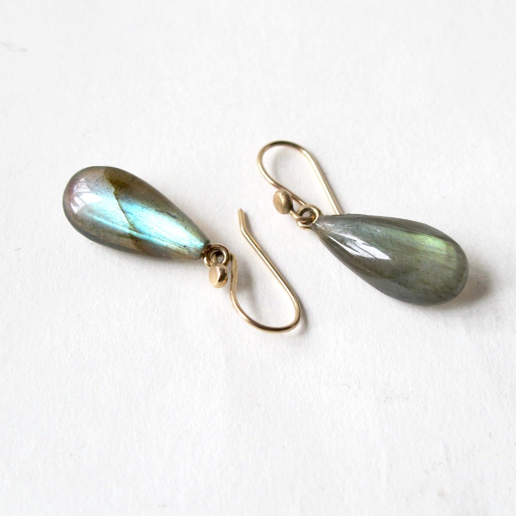 Bee-shaped earrings on a white background