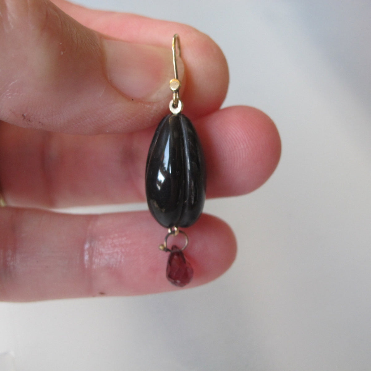 Carved Horn Earrings with Garnet