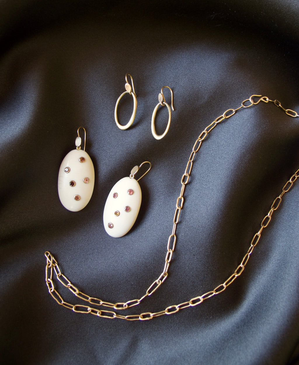 Hand Carved Oval Fossil Ivory Earrings with Tourmaline